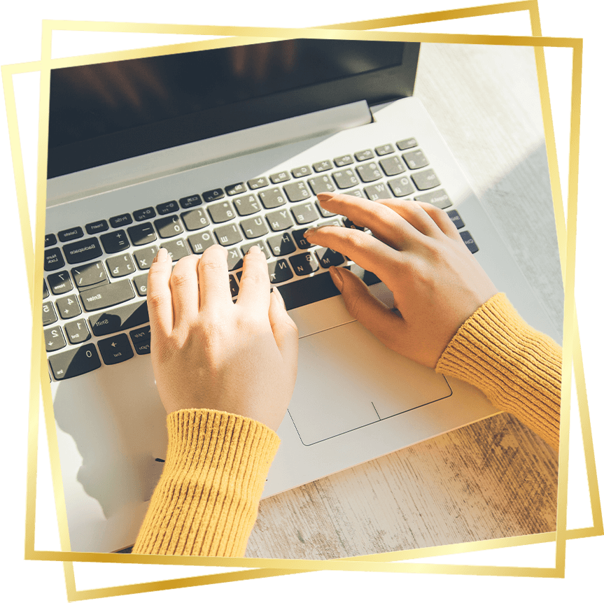 woman's hands on computer filling out new patient forms